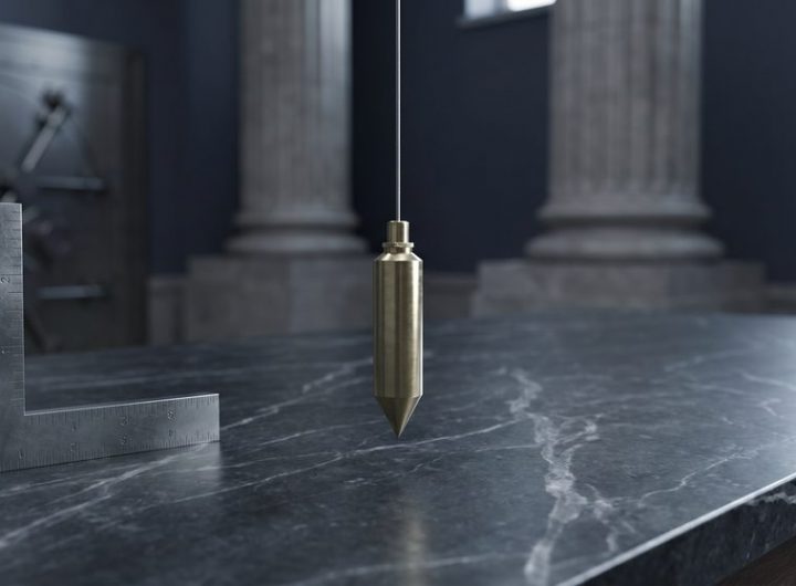 Brass plumb line, square, and gauge marks on a dark civic policy desk.